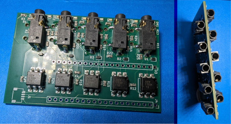 A board with 10 jacks, 5 on each side, on a blue background. There are tiny leds next to each port and a 5 optocouplers